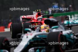 Kimi Raikkonen (FIN) Ferrari SF70H follows Lewis Hamilton (GBR) Mercedes AMG F1 W08. 15.07.2017. Formula 1 World Championship, Rd 10, British Grand Prix, Silverstone, England, Qualifying Day.