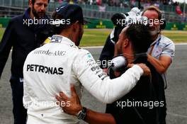 Lewis Hamilton (GBR) Mercedes AMG F1 celebrates his pole position with brother Nicolas Hamilton (GBR). 15.07.2017. Formula 1 World Championship, Rd 10, British Grand Prix, Silverstone, England, Qualifying Day.