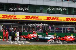 (L to R): Kimi Raikkonen (FIN) Ferrari; Sebastian Vettel (GER) Ferrari; and Lewis Hamilton (GBR) Mercedes AMG F1 in qualifying parc ferme. 15.07.2017. Formula 1 World Championship, Rd 10, British Grand Prix, Silverstone, England, Qualifying Day.