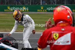 Lewis Hamilton (GBR) Mercedes AMG F1 W08 and Kimi Raikkonen (FIN) Ferrari SF70H. 15.07.2017. Formula 1 World Championship, Rd 10, British Grand Prix, Silverstone, England, Qualifying Day.