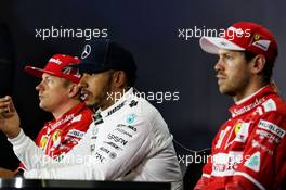 Lewis Hamilton (GBR) Mercedes AMG F1 with Kimi Raikkonen (FIN) Ferrari and Sebastian Vettel (GER) Ferrari in the post qualifying FIA Press Conference. 15.07.2017. Formula 1 World Championship, Rd 10, British Grand Prix, Silverstone, England, Qualifying Day.