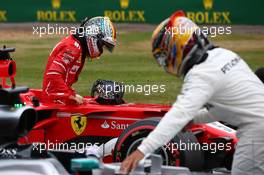 Sebastian Vettel (GER) Ferrari SF70H and Lewis Hamilton (GBR) Mercedes AMG F1 W08. 15.07.2017. Formula 1 World Championship, Rd 10, British Grand Prix, Silverstone, England, Qualifying Day.