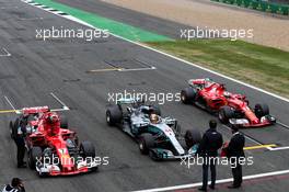 (L to R): Kimi Raikkonen (FIN) Ferrari SF70H; pole sitter Lewis Hamilton (GBR) Mercedes AMG F1 W08; and Sebastian Vettel (GER) Ferrari, in qualifying parc ferme. 15.07.2017. Formula 1 World Championship, Rd 10, British Grand Prix, Silverstone, England, Qualifying Day.