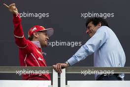 (L to R): Sebastian Vettel (GER) Ferrari with Mark Webber (AUS) Channel 4 Presenter. 13.07.2017. Formula 1 World Championship, Rd 10, British Grand Prix, Silverstone, England, Preparation Day.
