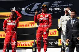 The podium (L to R): Kimi Raikkonen (FIN) Ferrari, second; Sebastian Vettel (GER) Ferrari, race winner; Valtteri Bottas (FIN) Mercedes AMG F1, third. 30.07.2017. Formula 1 World Championship, Rd 11, Hungarian Grand Prix, Budapest, Hungary, Race Day.