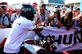 Lewis Hamilton (GBR) Mercedes AMG F1 signs autographs for the fans. 29.07.2017. Formula 1 World Championship, Rd 11, Hungarian Grand Prix, Budapest, Hungary, Qualifying Day.