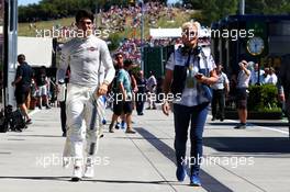 (L to R): Lance Stroll (CDN) Williams with Annie Bradshaw (GBR) Williams Press Officer. 29.07.2017. Formula 1 World Championship, Rd 11, Hungarian Grand Prix, Budapest, Hungary, Qualifying Day.