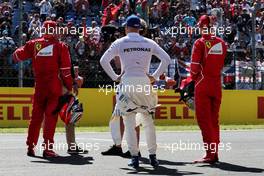 (L to R): Kimi Raikkonen (FIN) Ferrari in qualifying parc ferme with Will Buxton (GBR) NBC Sports Network TV Presenter; Valtteri Bottas (FIN) Mercedes AMG F1; and Sebastian Vettel (GER) Ferrari. 29.07.2017. Formula 1 World Championship, Rd 11, Hungarian Grand Prix, Budapest, Hungary, Qualifying Day.