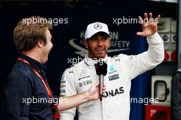 Lewis Hamilton (GBR) Mercedes AMG F1 celebrates his pole position with Davide Valsecchi (ITA) Sky F1 Italia Presenter in qualifying parc ferme. 02.09.2017. Formula 1 World Championship, Rd 13, Italian Grand Prix, Monza, Italy, Qualifying Day.