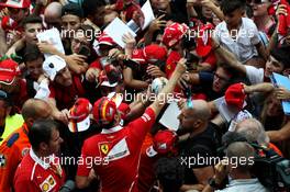 Sebastian Vettel (GER) Ferrari signs autographs for the fans. 31.08.2017. Formula 1 World Championship, Rd 13, Italian Grand Prix, Monza, Italy, Preparation Day.