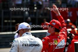 Kimi Raikkonen (FIN) Ferrari celebrates his pole position in parc ferme with Valtteri Bottas (FIN) Mercedes AMG F1. 27.05.2017. Formula 1 World Championship, Rd 6, Monaco Grand Prix, Monte Carlo, Monaco, Qualifying Day.
