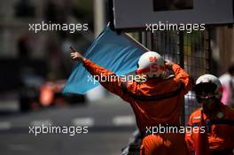 A marshal waves a blue flag. 27.05.2017. Formula 1 World Championship, Rd 6, Monaco Grand Prix, Monte Carlo, Monaco, Qualifying Day.