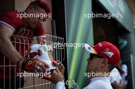 Sebastian Vettel (GER) Ferrari signs autographs for the fans. 25.05.2017. Formula 1 World Championship, Rd 6, Monaco Grand Prix, Monte Carlo, Monaco, Practice Day.