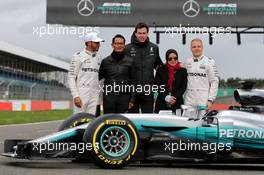 Lewis Hamilton (GBR) Mercedes AMG F1; Toto Wolff (GER) Mercedes AMG F1 Shareholder and Executive Director; and Valtteri Bottas (FIN) Mercedes AMG F1, with guests. 23.02.2017. Mercedes AMG F1 W08 Launch, Silverstone, England.