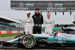 (L to R): Lewis Hamilton (GBR) Mercedes AMG F1; Toto Wolff (GER) Mercedes AMG F1 Shareholder and Executive Director; Valtteri Bottas (FIN) Mercedes AMG F1, with the Mercedes AMG F1 W08. 23.02.2017. Mercedes AMG F1 W08 Launch, Silverstone, England.