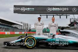 (L to R): Lewis Hamilton (GBR) Mercedes AMG F1 with Valtteri Bottas (FIN) Mercedes AMG F1, and the Mercedes AMG F1 W08. 23.02.2017. Mercedes AMG F1 W08 Launch, Silverstone, England.