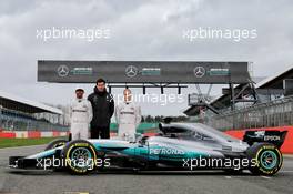 (L to R): Lewis Hamilton (GBR) Mercedes AMG F1; Toto Wolff (GER) Mercedes AMG F1 Shareholder and Executive Director; Valtteri Bottas (FIN) Williams, with the Mercedes AMG F1 W08. 23.02.2017. Mercedes AMG F1 W08 Launch, Silverstone, England.