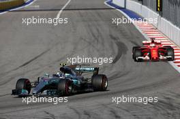 Valtteri Bottas (FIN) Mercedes AMG F1 W08 leads Sebastian Vettel (GER) Ferrari SF70H. 30.04.2017. Formula 1 World Championship, Rd 4, Russian Grand Prix, Sochi Autodrom, Sochi, Russia, Race Day.