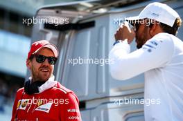 (L to R): Sebastian Vettel (GER) Ferrari and Lewis Hamilton (GBR) Mercedes AMG F1 on the drivers parade. 30.04.2017. Formula 1 World Championship, Rd 4, Russian Grand Prix, Sochi Autodrom, Sochi, Russia, Race Day.