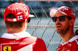 (L to R): Kimi Raikkonen (FIN) Ferrari with team mate Sebastian Vettel (GER) Ferrari. 27.04.2017. Formula 1 World Championship, Rd 4, Russian Grand Prix, Sochi Autodrom, Sochi, Russia, Preparation Day.