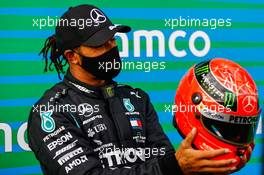 Race winner Lewis Hamilton (GBR) Mercedes AMG F1 is presented with the helmet of Michael Schumacher (GER) in parc ferme after equalling the record for the number of F1 victories. 11.10.2020. Formula 1 World Championship, Rd 11, Eifel Grand Prix, Nurbugring, Germany, Race Day.