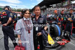 Chalerm Yoovidhya (THA) Red Bull Racing Co-Owner with his wife on the grid. 02.07.2023. Formula 1 World Championship, Rd 10, Austrian Grand Prix, Spielberg, Austria, Race Day.