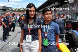 Family of Chalerm Yoovidhya (THA) Red Bull Racing Co-Owner on the grid. 02.07.2023. Formula 1 World Championship, Rd 10, Austrian Grand Prix, Spielberg, Austria, Race Day.