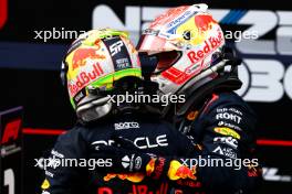 (L to R): Sergio Perez (MEX) Red Bull Racing with race winner and team mate Max Verstappen (NLD) Red Bull Racing in parc ferme. 02.07.2023. Formula 1 World Championship, Rd 10, Austrian Grand Prix, Spielberg, Austria, Race Day.