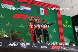  2nd place Charles Leclerc (MON) Ferrari F1-23 with Phil Turner (GBR) Red Bull Racing Chief Mechanic Representing Red Bull, 1st place Max Verstappen (NLD) Red Bull Racing and 3rd place Sergio Perez (MEX) Red Bull Racing RB19. 02.07.2023. Formula 1 World Championship, Rd 10, Austrian Grand Prix, Spielberg, Austria, Race Day.