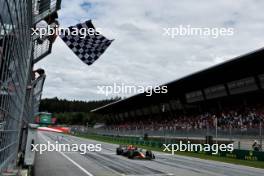 Race winner Max Verstappen (NLD) Red Bull Racing RB19 takes the chequered flag at the end of the race. 02.07.2023. Formula 1 World Championship, Rd 10, Austrian Grand Prix, Spielberg, Austria, Race Day.