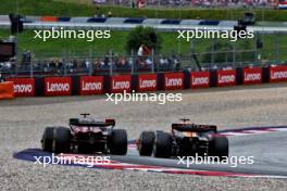Valtteri Bottas (FIN) Alfa Romeo F1 Team C43 and Oscar Piastri (AUS) McLaren MCL60 battle for position. 02.07.2023. Formula 1 World Championship, Rd 10, Austrian Grand Prix, Spielberg, Austria, Race Day.