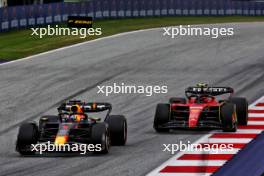 Max Verstappen (NLD) Red Bull Racing RB19 leads Carlos Sainz Jr (ESP) Ferrari SF-23. 02.07.2023. Formula 1 World Championship, Rd 10, Austrian Grand Prix, Spielberg, Austria, Race Day.