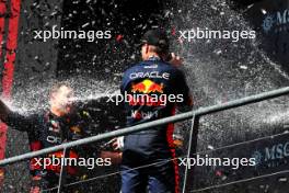 Race winner Max Verstappen (NLD) Red Bull Racing celebrates with Greg Reeson (GBR) Red Bull Racing Tyre Technician on the podium. 30.07.2023. Formula 1 World Championship, Rd 13, Belgian Grand Prix, Spa Francorchamps, Belgium, Race Day.