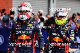 (L to R): Race winner Max Verstappen (NLD) Red Bull Racing celebrates with second placed team mate Sergio Perez (MEX) Red Bull Racing in parc ferme. 30.07.2023. Formula 1 World Championship, Rd 13, Belgian Grand Prix, Spa Francorchamps, Belgium, Race Day.