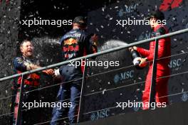 Race winner Max Verstappen (NLD) Red Bull Racing celebrates with Greg Reeson (GBR) Red Bull Racing Tyre Technician and Charles Leclerc (MON) Ferrari on the podium. 30.07.2023. Formula 1 World Championship, Rd 13, Belgian Grand Prix, Spa Francorchamps, Belgium, Race Day.