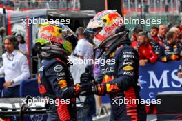 (L to R): Sergio Perez (MEX) Red Bull Racing celebrates his second position with race winner Max Verstappen (NLD) Red Bull Racing in parc ferme. 30.07.2023. Formula 1 World Championship, Rd 13, Belgian Grand Prix, Spa Francorchamps, Belgium, Race Day.