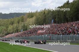 Charles Leclerc (MON) Ferrari SF-23 and Sergio Perez (MEX) Red Bull Racing RB19 battle at the start of the race. 30.07.2023. Formula 1 World Championship, Rd 13, Belgian Grand Prix, Spa Francorchamps, Belgium, Race Day.