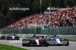 Valtteri Bottas (FIN) Alfa Romeo F1 Team C43 and Esteban Ocon (FRA) Alpine F1 Team A523 battle for position. 30.07.2023. Formula 1 World Championship, Rd 13, Belgian Grand Prix, Spa Francorchamps, Belgium, Race Day.