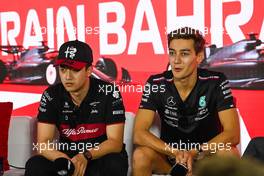 (L to R): Zhou Guanyu (CHN) Alfa Romeo F1 Team and George Russell (GBR) Mercedes AMG F1 in the FIA Press Conference. 02.03.2023. Formula 1 World Championship, Rd 1, Bahrain Grand Prix, Sakhir, Bahrain, Preparation Day.