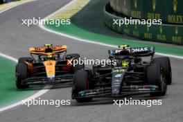 Lewis Hamilton (GBR) Mercedes AMG F1 W14 and Lando Norris (GBR) McLaren MCL60 leave the pits. 03.11.2023. Formula 1 World Championship, Rd 21, Brazilian Grand Prix, Sao Paulo, Brazil, Qualifying Day.