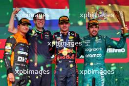 The podium (L to R): Lando Norris (GBR) McLaren, second; Jeff Calam (GBR) Red Bull Racing Senior Projects Engineer; Max Verstappen (NLD) Red Bull Racing, race winner; Fernando Alonso (ESP) Aston Martin F1 Team, third. 05.11.2023. Formula 1 World Championship, Rd 21, Brazilian Grand Prix, Sao Paulo, Brazil, Race Day.