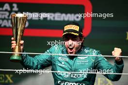 Fernando Alonso (ESP) Aston Martin F1 Team celebrates his third position on the podium. 05.11.2023. Formula 1 World Championship, Rd 21, Brazilian Grand Prix, Sao Paulo, Brazil, Race Day.