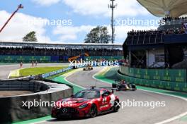 Max Verstappen (NLD) Red Bull Racing RB19 leads behind the Mercedes AMG FIA Safety Car. 05.11.2023. Formula 1 World Championship, Rd 21, Brazilian Grand Prix, Sao Paulo, Brazil, Race Day.