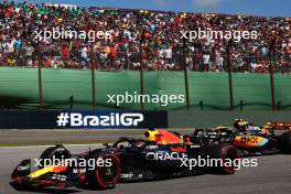 Max Verstappen (NLD) Red Bull Racing RB19 and Lando Norris (GBR) McLaren MCL60. 05.11.2023. Formula 1 World Championship, Rd 21, Brazilian Grand Prix, Sao Paulo, Brazil, Race Day.