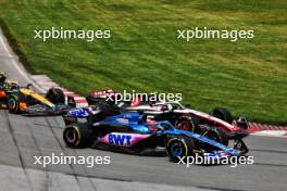 Esteban Ocon (FRA) Alpine F1 Team A523 and Nico Hulkenberg (GER) Haas VF-23 battle for position at the start of the race. 18.06.2023. Formula 1 World Championship, Rd 9, Canadian Grand Prix, Montreal, Canada, Race Day.