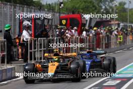 Alexander Albon (THA) Williams Racing FW45 and Lando Norris (GBR) McLaren MCL60 leave the pits. 18.06.2023. Formula 1 World Championship, Rd 9, Canadian Grand Prix, Montreal, Canada, Race Day.