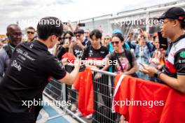 Zhou Guanyu (CHN) Alfa Romeo F1 Team with fans in the pits. 15.06.2023. Formula 1 World Championship, Rd 9, Canadian Grand Prix, Montreal, Canada, Preparation Day.