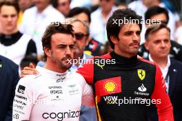 (L to R): Fernando Alonso (ESP) Aston Martin F1 Team and Carlos Sainz Jr (ESP) Ferrari as the grid observes the national anthem. 04.06.2023. Formula 1 World Championship, Rd 8, Spanish Grand Prix, Barcelona, Spain, Race Day.
