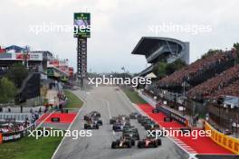 Max Verstappen (NLD) Red Bull Racing RB19 and Carlos Sainz Jr (ESP) Ferrari SF-23 battle for the lead at the start of the race. 04.06.2023. Formula 1 World Championship, Rd 8, Spanish Grand Prix, Barcelona, Spain, Race Day.