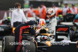 Race winner Max Verstappen (NLD) Red Bull Racing RB19 with second placed Lando Norris (GBR) McLaren MCL60 in parc ferme. 09.07.2023. Formula 1 World Championship, Rd 11, British Grand Prix, Silverstone, England, Race Day.